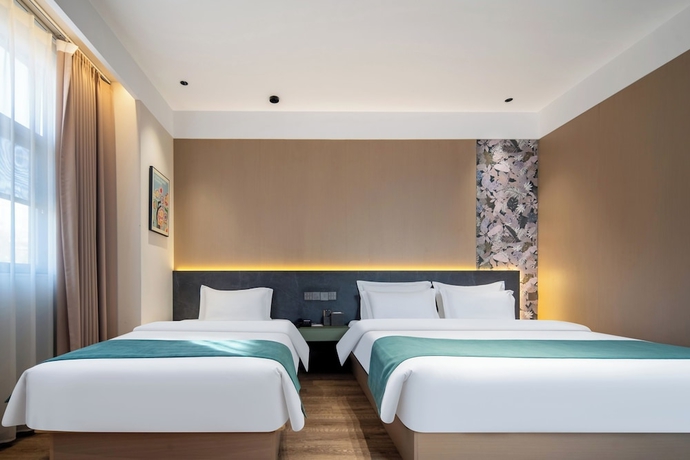 Imagen de la habitación del Hotel zhuyingwanghehuayuanjiudian. Foto 4