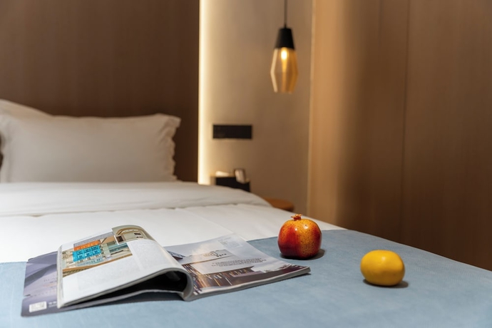 Imagen de la habitación del Hotel zhuyingwanghehuayuanjiudian. Foto 6