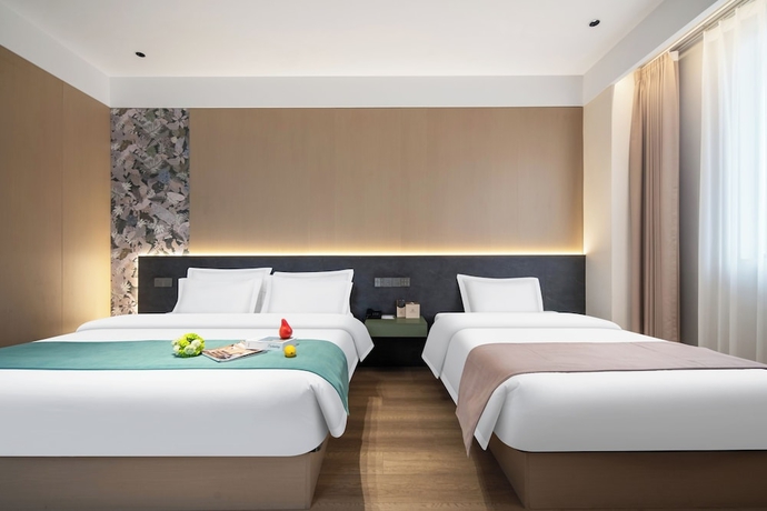 Imagen de la habitación del Hotel zhuyingwanghehuayuanjiudian. Foto 9