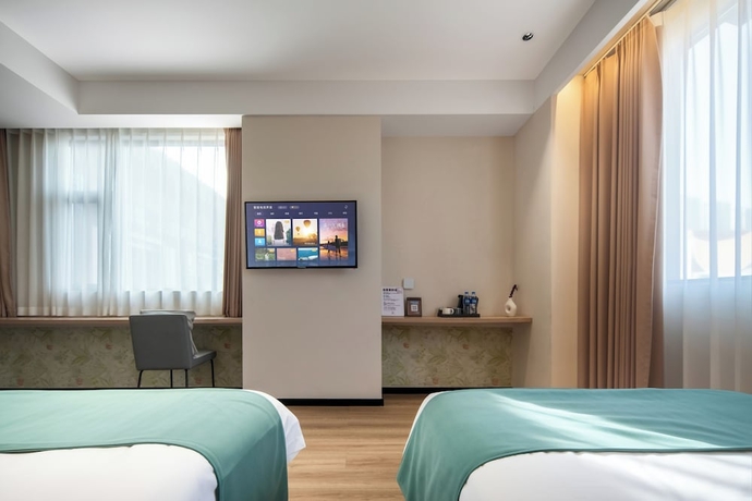 Imagen de la habitación del Hotel zhuyingwanghehuayuanjiudian. Foto 10
