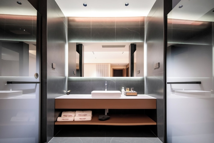 Imagen de la habitación del Hotel zhuyingwanghehuayuanjiudian. Foto 11
