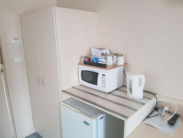 Imagen de la habitación del Motel Acacia Griffith. Foto 19