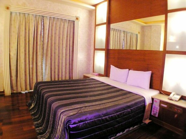 Imagen de la habitación del Motel Changsing Business. Foto 12