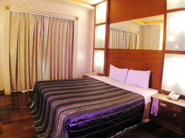 Imagen de la habitación del Motel Changsing Business. Foto 19