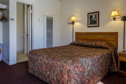 Imagen de la habitación del Motel Charm and Suites. Foto 10
