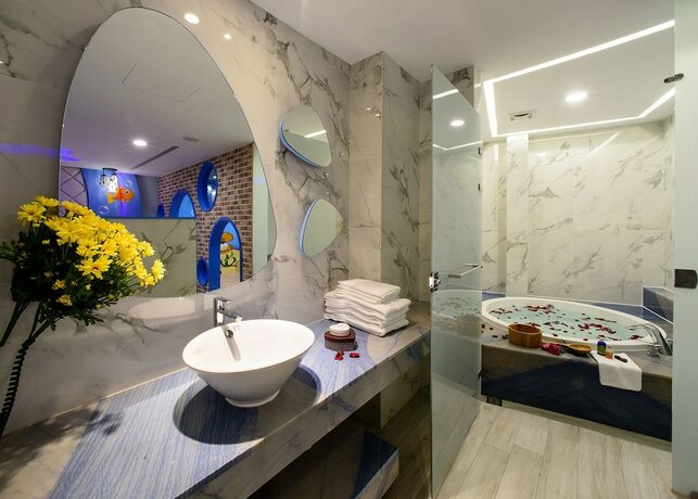 Imagen de la habitación del Motel Chen He Spa. Foto 17