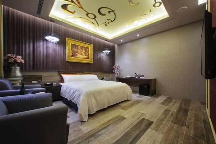 Imagen de la habitación del Motel Chen He Spa. Foto 26
