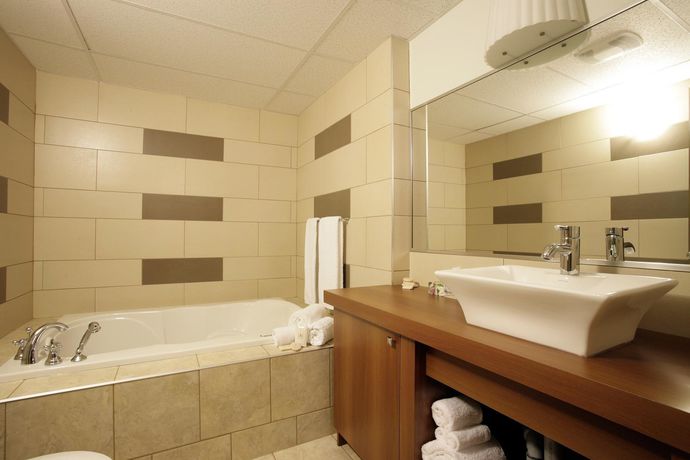 Imagen de la habitación del Motel Clarion Pointe La Malbaie. Foto 12