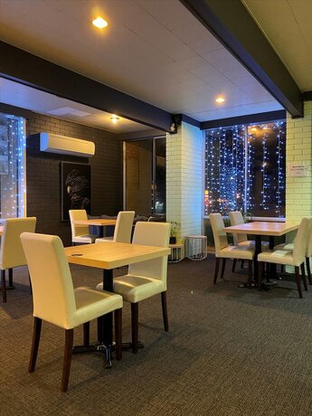 Imagen del bar/restaurante del Motel Country Gardens. Foto 13