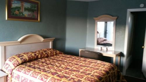 Imagen de la habitación del Motel Deluxe, Pomona. Foto 1