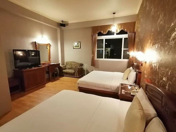 Imagen de la habitación del Motel Dibao. Foto 18