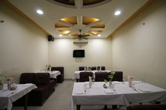 Imagen del bar/restaurante del Motel Divine International, Roorkee. Foto 21