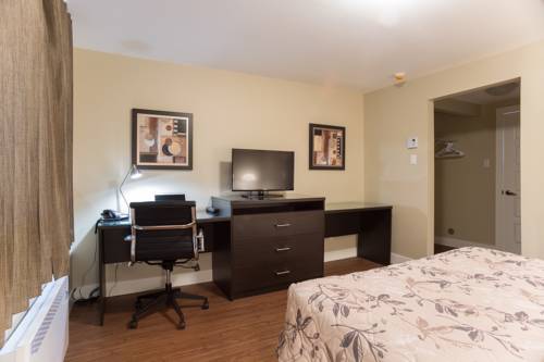 Imagen de la habitación del Motel Du Fleuve. Foto 5