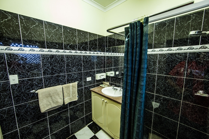 Imagen de la habitación del Motel Elkira Court. Foto 11