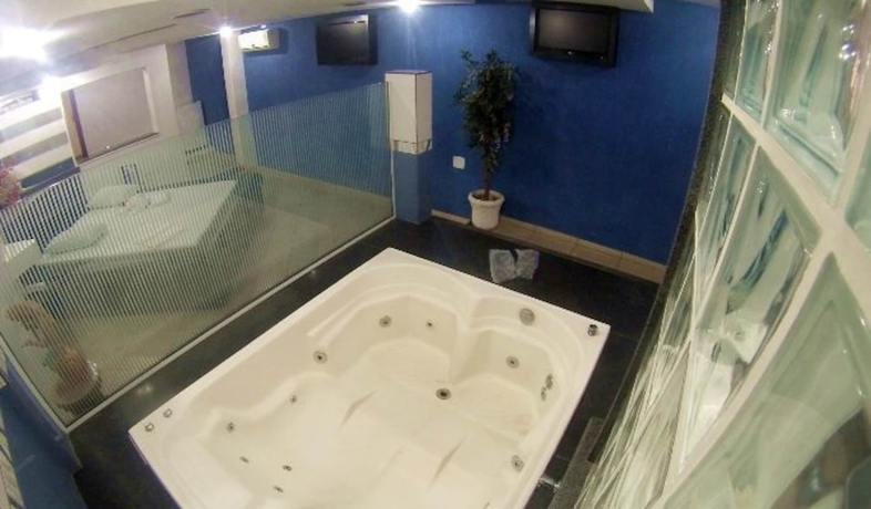 Imagen de la habitación del Motel Flamboyant - Adults Only. Foto 5