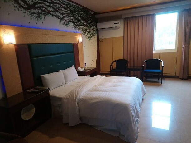 Imagen de la habitación del Motel Hua Du, Jiji. Foto 7