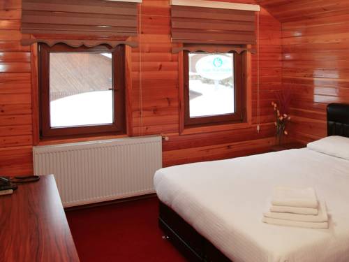 Imagen de la habitación del Motel Inanlar Deluxe Hotel and Bungalow. Foto 2
