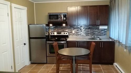 Imagen de la habitación del Motel Malahat Bungalows. Foto 7