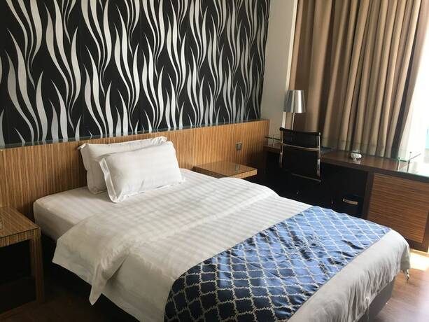 Imagen de la habitación del Motel New World, BINTULU. Foto 24