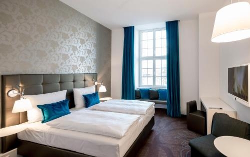 Imagen de la habitación del Motel One Magdeburg. Foto 10