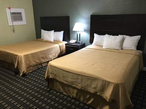 Imagen de la habitación del Motel Palm Tropics. Foto 7