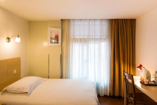 Imagen de la habitación del Motel Qidong Middle Jianghai Road. Foto 6