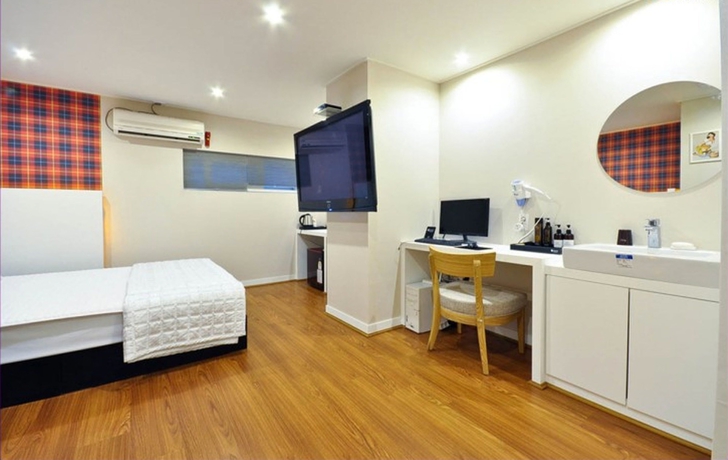 Imagen de la habitación del Motel Seven Songjeong. Foto 12