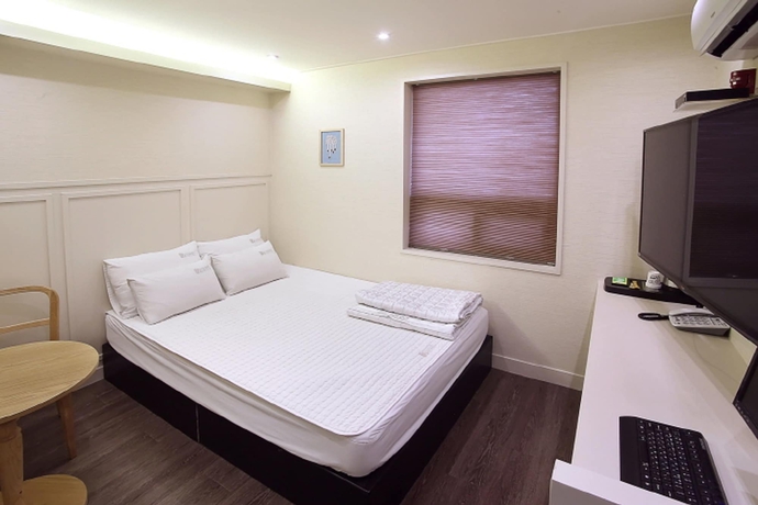 Imagen de la habitación del Motel Seven Songjeong. Foto 16
