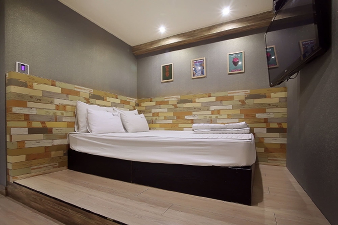 Imagen de la habitación del Motel Seven Songjeong. Foto 18