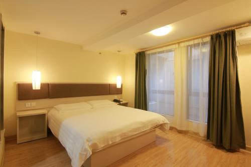 Imagen de la habitación del Motel Shanghai Jinshajiang Road Daduhe Road Metro. Foto 7