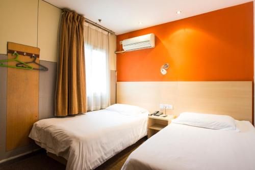 Imagen de la habitación del Motel Shanghai Nanjing Road People's Square. Foto 6