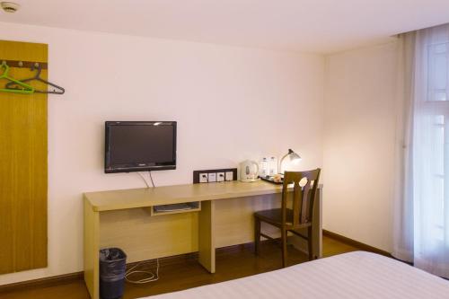 Imagen de la habitación del Motel Shanghai Nanjing Road People's Square. Foto 9