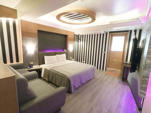 Imagen de la habitación del Motel Shihua. Foto 28
