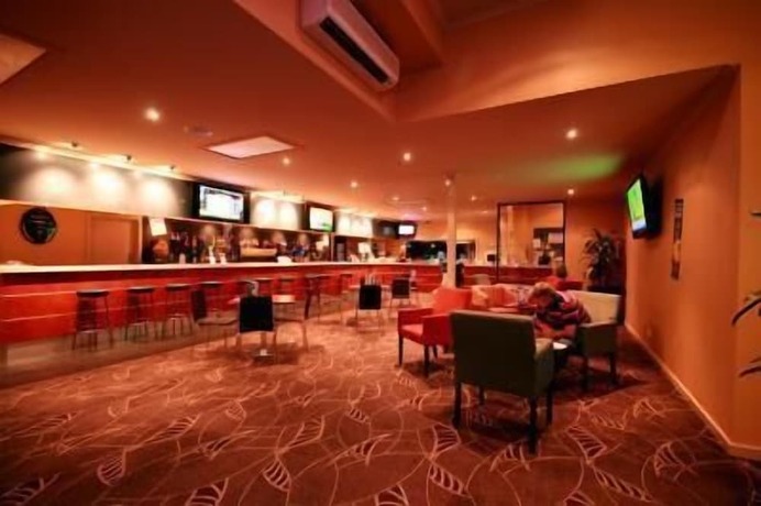 Imagen del bar/restaurante del Motel Sundowner Hotel. Foto 15