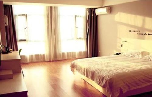 Imagen de la habitación del Motel Yi'ning Beihuan Road Shanghaicheng. Foto 6