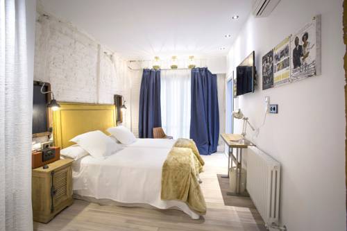 Imagen de la habitación del Pensión Boutique Caravan Cinema. Foto 12