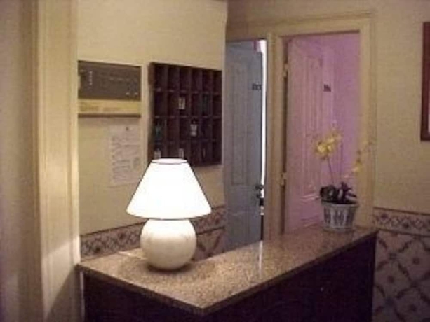 Imagen de los interiores del Pensión Pensao Flor Da Baixa. Foto 18