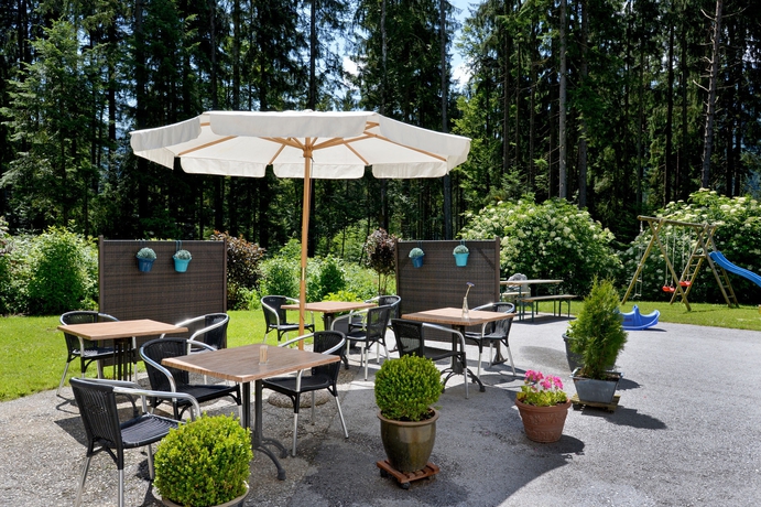 Imagen del bar/restaurante del Pensión Und Appartements Hartkaiser. Foto 5