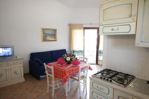 Imagen de la habitación del Residencia Le Corti di Marinella. Foto 11