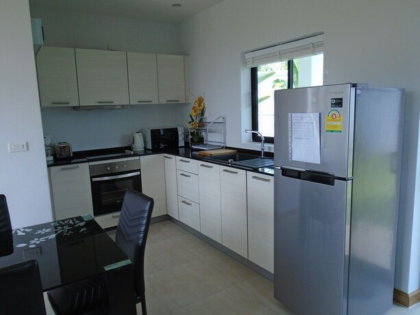 Imagen de la habitación del Resort Sunrise Villa Resort. Foto 6