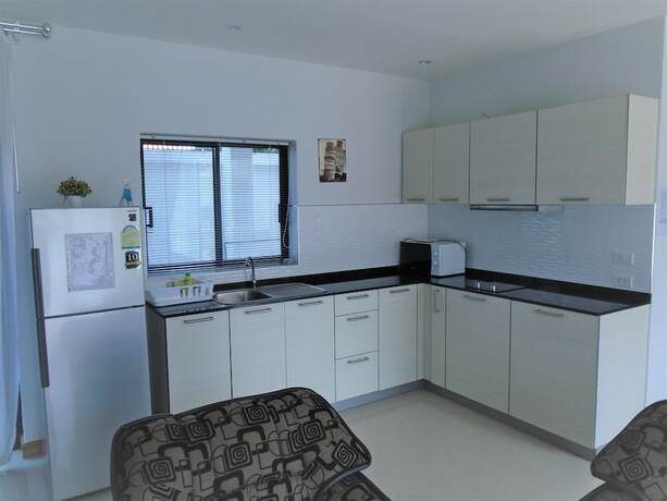 Imagen de la habitación del Resort Sunrise Villa Resort. Foto 11