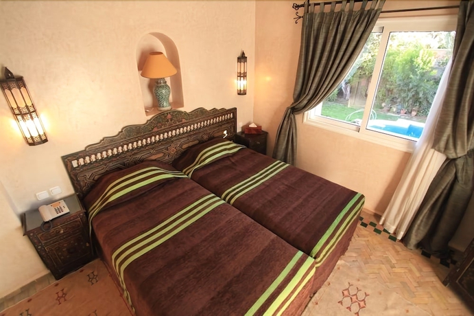 Imagen de la habitación del Riad Villa Des Trois Golfs. Foto 16