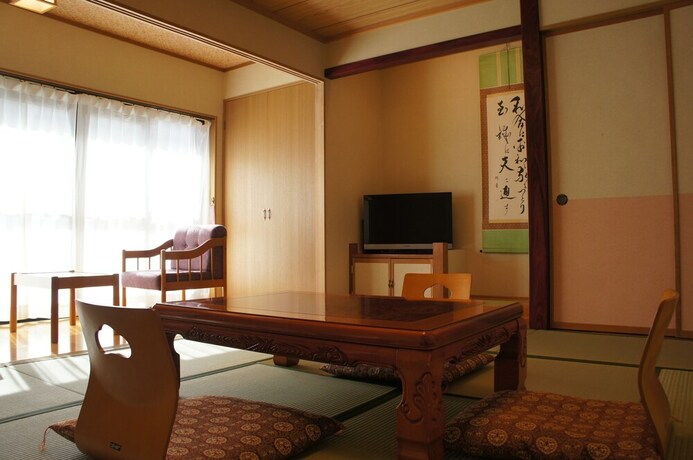Imagen de la habitación del Ryokan Kakeyu Onsen Kutsurogi No Yado Kuroiwa. Foto 17