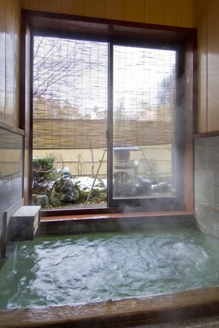 Imagen de la piscina del Ryokan Kusatsu Onsen Ekinariya. Foto 27