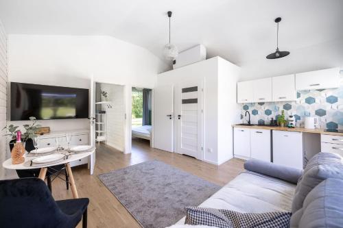 Imagen de la habitación del Viviendas Turísticas Vacacionales Lumi Resort Domki letniskowe z podgrzewanym basenem. Foto 3