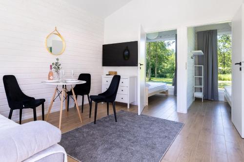 Imagen de la habitación del Viviendas Turísticas Vacacionales Lumi Resort Domki letniskowe z podgrzewanym basenem. Foto 6