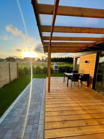 Imagen de la habitación del Viviendas Turísticas Vacacionales RResort - nowe domki z PODGRZEWANYM Basenem, WiFi, parking w cenie!. Foto 2