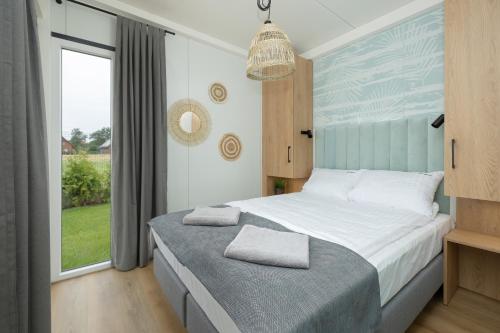 Imagen de la habitación del Viviendas Turísticas Vacacionales RResort - nowe domki z PODGRZEWANYM Basenem, WiFi, parking w cenie!. Foto 5