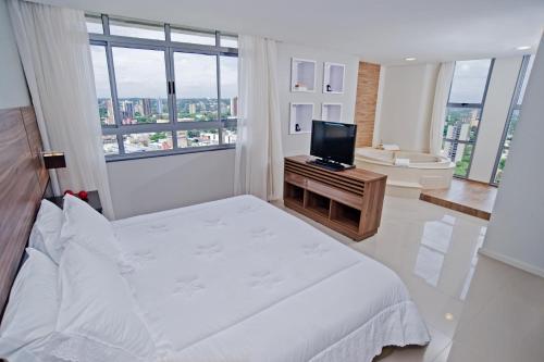 Suite con bañera de hidromasaje - Cama extragrande del hotel Wyndham Foz Do Iguaçu. Foto 2