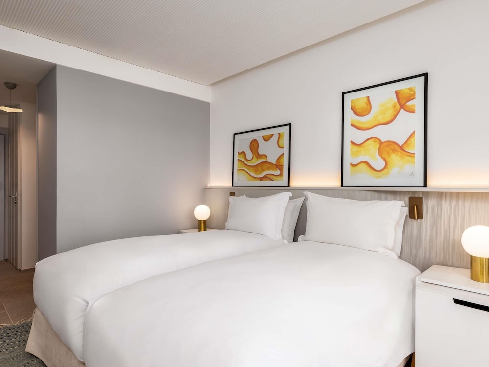 Habitación Prestige, 2 camas individuales y vista parcial al mar del hotel Sofitel Agadir Thalassa Sea and Spa